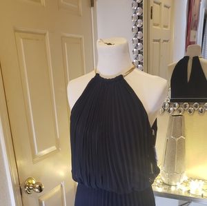 Navy blue halter neck dress with gold metal hardware.